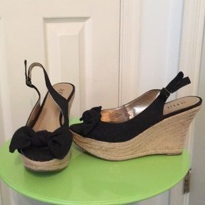 Ana sling back espadrilles with peep toe and bow.